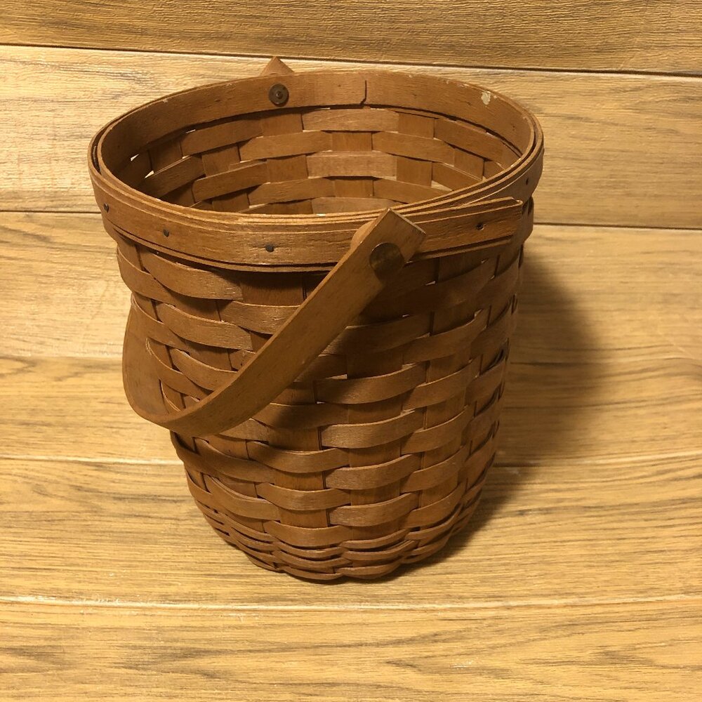 Longaberger basket dated 1992 and signed basket with a handle,